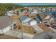 Aerial view of a home with a well-manicured front yard in a lovely neighborhood at 1141 Bethpage Dr., Myrtle Beach, SC 29579