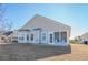 House exterior showcasing back patio and screened porch at 1141 Bethpage Dr., Myrtle Beach, SC 29579