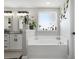 Relaxing bathroom with soaking tub and large window, plants, and modern fixtures at 1141 Bethpage Dr., Myrtle Beach, SC 29579