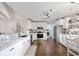 Bright kitchen with granite countertops, white cabinets, stainless steel appliances, and hardwood floors at 1141 Bethpage Dr., Myrtle Beach, SC 29579