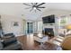 Inviting living room with a fireplace, plush seating, and access to a screened porch at 1141 Bethpage Dr., Myrtle Beach, SC 29579