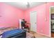 Pink walls and a closet in this small bedroom at 115 Horizon River Dr. # 8D, Myrtle Beach, SC 29588