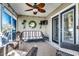 Cozy screened porch with wicker furniture and a TV at 116 Emily Springs Dr., Conway, SC 29527