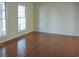 Bright living room with hardwood floors and large windows at 1203 Sharon Ave., Marion, SC 29571