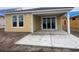 Backyard with a concrete patio and sliding glass doors to access the home at 1252 Lady Bird Way, North Myrtle Beach, SC 29582