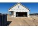 Unfinished house exterior under construction, showing the framing and house wrap at 1252 Lady Bird Way, North Myrtle Beach, SC 29582