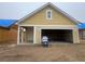 A new construction home features a spacious two-car garage with a neutral exterior at 1252 Lady Bird Way, North Myrtle Beach, SC 29582