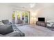 Living room with sliding glass doors leading to a patio and a cozy couch at 1280 White Tree Ln. # G, Myrtle Beach, SC 29588