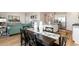 Dining room with black table and chairs, view into kitchen at 1465 Nokota Dr., Conway, SC 29526