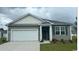 Charming single-story home featuring a two-car garage and well-maintained landscaping at 1480 Nokota Dr., Conway, SC 29526