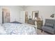 Main bedroom with a dresser and chair, view into the dining area, and access to a bathroom at 1489 Nokota Dr., Conway, SC 29526