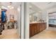 Bathroom with double vanity and access to the main bedroom and closet at 1536 Suncrest Dr., Myrtle Beach, SC 29577