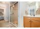 Bathroom with walk-in shower and wood vanity at 1536 Suncrest Dr., Myrtle Beach, SC 29577