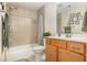 Bathroom with tub, shower, and light wood vanity at 1536 Suncrest Dr., Myrtle Beach, SC 29577