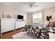 Bedroom with floral bedding, dresser, and large window at 1536 Suncrest Dr., Myrtle Beach, SC 29577