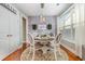 Charming dining area with a round table, four chairs, and an accent wall at 1536 Suncrest Dr., Myrtle Beach, SC 29577