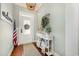 Bright entryway with hardwood floors, console table, and decorative wreath at 1536 Suncrest Dr., Myrtle Beach, SC 29577