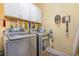 Laundry room with washer, dryer, and overhead cabinets at 1536 Suncrest Dr., Myrtle Beach, SC 29577