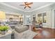 Spacious living room featuring hardwood floors, comfortable seating, and a view into the kitchen at 1536 Suncrest Dr., Myrtle Beach, SC 29577