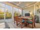 Bright screened porch with dining area and wooded views at 1536 Suncrest Dr., Myrtle Beach, SC 29577