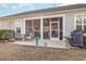 Relaxing screened porch with patio furniture and grill at 1536 Suncrest Dr., Myrtle Beach, SC 29577