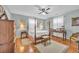 Cozy bedroom with a four poster bed, hardwood floors, and soft natural light at 16 Johnstone Ln., Georgetown, SC 29440