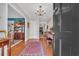 Elegant foyer featuring hardwood floors, a classic chandelier, and a grand piano at 16 Johnstone Ln., Georgetown, SC 29440