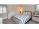 Bedroom with striped bedding and built-in closet at 175 Saint Clears Way # 23A, Myrtle Beach, SC 29572