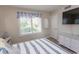 Bedroom with white dresser and large window with shutters at 175 Saint Clears Way # 23A, Myrtle Beach, SC 29572