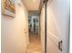 Hallway with barn doors and light wood flooring at 175 Saint Clears Way # 23A, Myrtle Beach, SC 29572