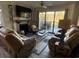 Relaxing living room with fireplace and access to a deck at 175 Saint Clears Way # 23A, Myrtle Beach, SC 29572