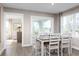 Bright dining area with a table and chairs near sliding glass doors at 2055 Nw Parow Ln Nw # A, Calabash, NC 28467