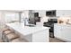 Kitchen island with seating, white quartz countertop, and stainless steel sink at 2055 Nw Parow Ln Nw # A, Calabash, NC 28467