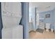 Neat bathroom with laundry machines, modern vanity, and a bathtub/shower combo at 2100 Sea Mountain Hwy. # 630, North Myrtle Beach, SC 29582