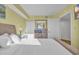 Bright bedroom with neutral tones featuring a decorative mirror, lamps, and closet at 2100 Sea Mountain Hwy. # 630, North Myrtle Beach, SC 29582