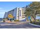 Harborage Resort building exterior, featuring parking and landscaping at 2100 Sea Mountain Hwy. # 630, North Myrtle Beach, SC 29582