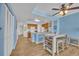 Open kitchen with wood cabinets, granite countertops, and a view into the living area at 2100 Sea Mountain Hwy. # 630, North Myrtle Beach, SC 29582