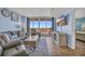 Cozy living room with water views, comfortable seating, a flat-screen TV, and stylish décor at 2100 Sea Mountain Hwy. # 630, North Myrtle Beach, SC 29582