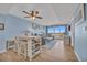 Open-concept living room with balcony access, modern décor, and a dining area with bar seating at 2100 Sea Mountain Hwy. # 630, North Myrtle Beach, SC 29582