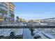 View of a marina from a building, showcasing boats docked and a scenic waterfront setting at 2100 Sea Mountain Hwy. # 630, North Myrtle Beach, SC 29582