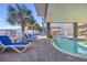Outdoor pool area with lounge chairs and palm trees, offering a relaxing space by the water at 2100 Sea Mountain Hwy. # 630, North Myrtle Beach, SC 29582