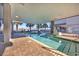 Relaxing indoor pool area with ample seating, palm trees, and shallow-entry access at 2100 Sea Mountain Hwy. # 630, North Myrtle Beach, SC 29582