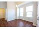 Simple dining room with hardwood floors and large windows at 2117 Mirabel Ct., North Myrtle Beach, SC 29582