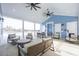 Clubhouse covered patio with seating, ceiling fans, and views of the pool at 2155 Gooseberry Way, Longs, SC 29568