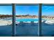 Relaxing view of community pool with lounge chairs and neighborhood in the distance at 2155 Gooseberry Way, Longs, SC 29568