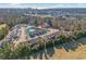 Aerial view of townhomes surrounding a pond with fountain, with ocean and city skyline in background at 2404 Thoroughfare Dr. # 2404, North Myrtle Beach, SC 29582