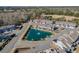 Aerial view of townhomes surrounding a serene pond with a fountain and lush landscaping at 2404 Thoroughfare Dr. # 2404, North Myrtle Beach, SC 29582