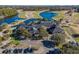 Aerial view of a clubhouse with a golf course and lake in the background at 2404 Thoroughfare Dr. # 2404, North Myrtle Beach, SC 29582