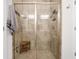 Modern bathroom boasts a glass-enclosed shower with stylish tiling and a built-in wooden bench at 2404 Thoroughfare Dr. # 2404, North Myrtle Beach, SC 29582