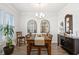 Well lit dining room, hardwood floors, and dark wood table at 2404 Thoroughfare Dr. # 2404, North Myrtle Beach, SC 29582